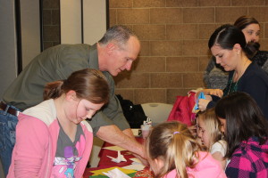 Paul Johnson teaches participants to make an origami dog and a flapping bird.